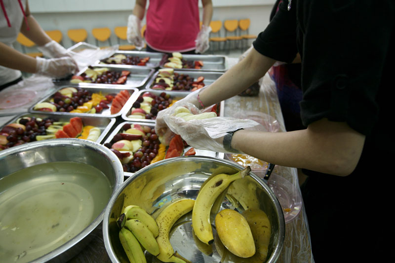 Parent volunteers are preparing food