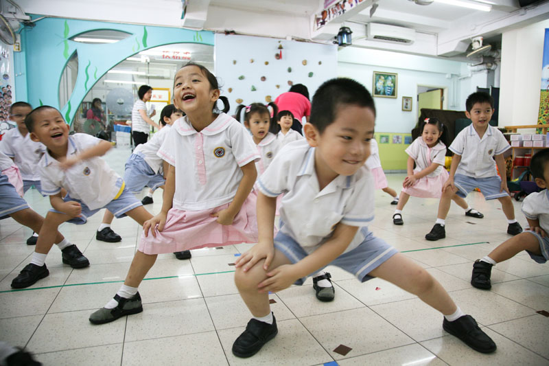 Children are doing stretching exercise