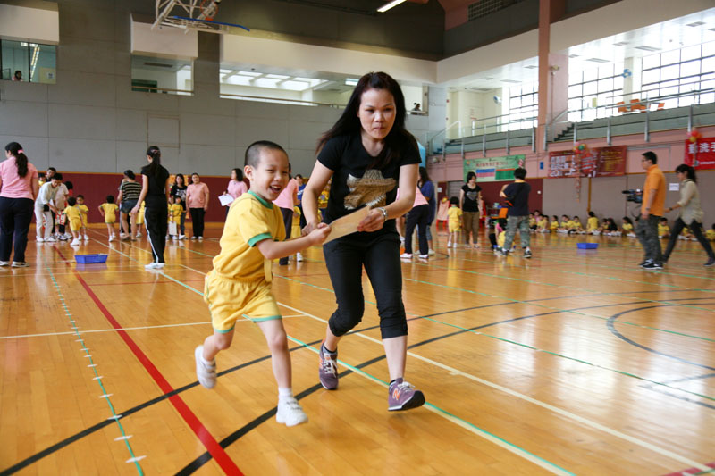Parents and children are participating in physical games