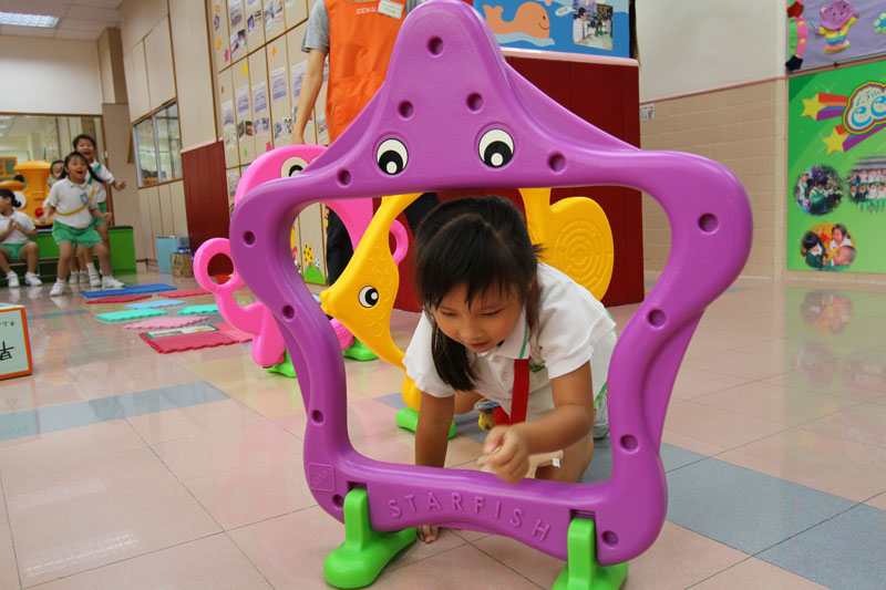 A child is playing in a competition