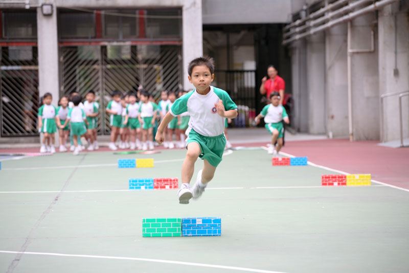 A child is crossing the paper brick